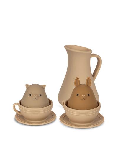 silicone tea set, one pitcher, 2 tea cups and one bunny and one cat that sit in the tea cups. the set is earth tones. 