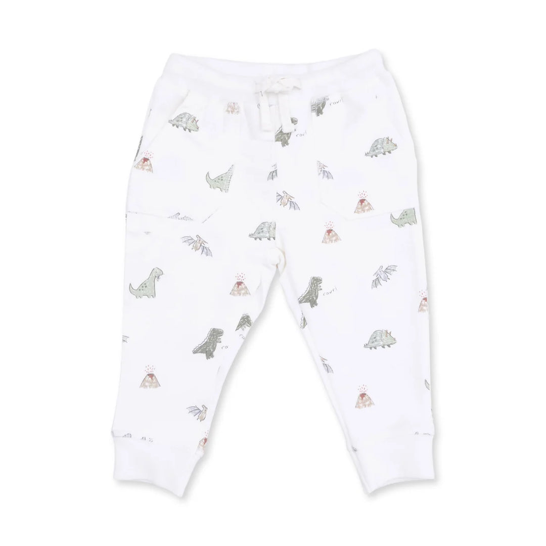 White children's jogger pants with an all-over print of small dinosaurs and teepees, featuring an elastic waistband with a white drawstring and ribbed ankle cuffs.