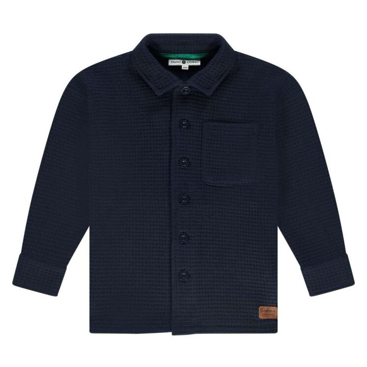 Navy blue textured shirt with buttons on a white background