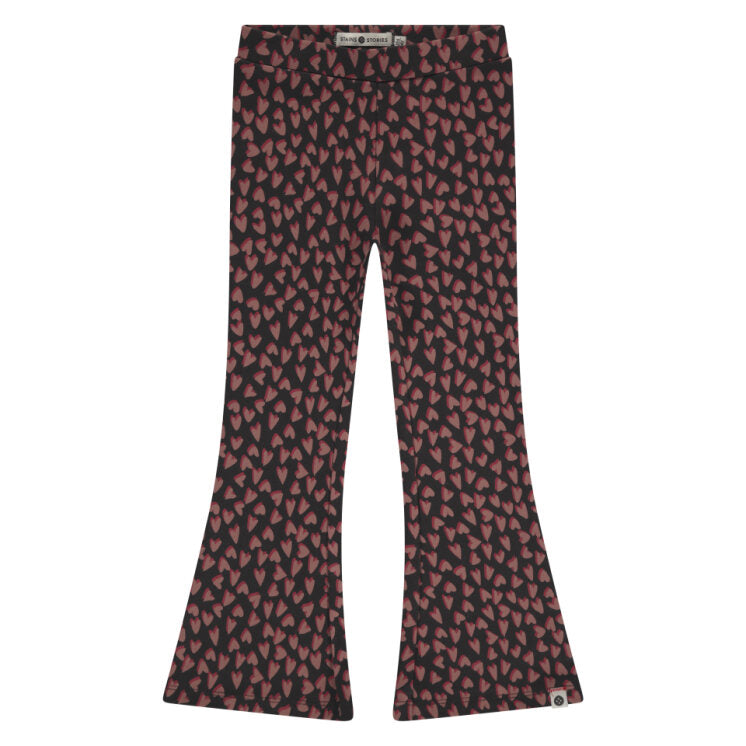 Flared pants with a red and black pattern on a white background