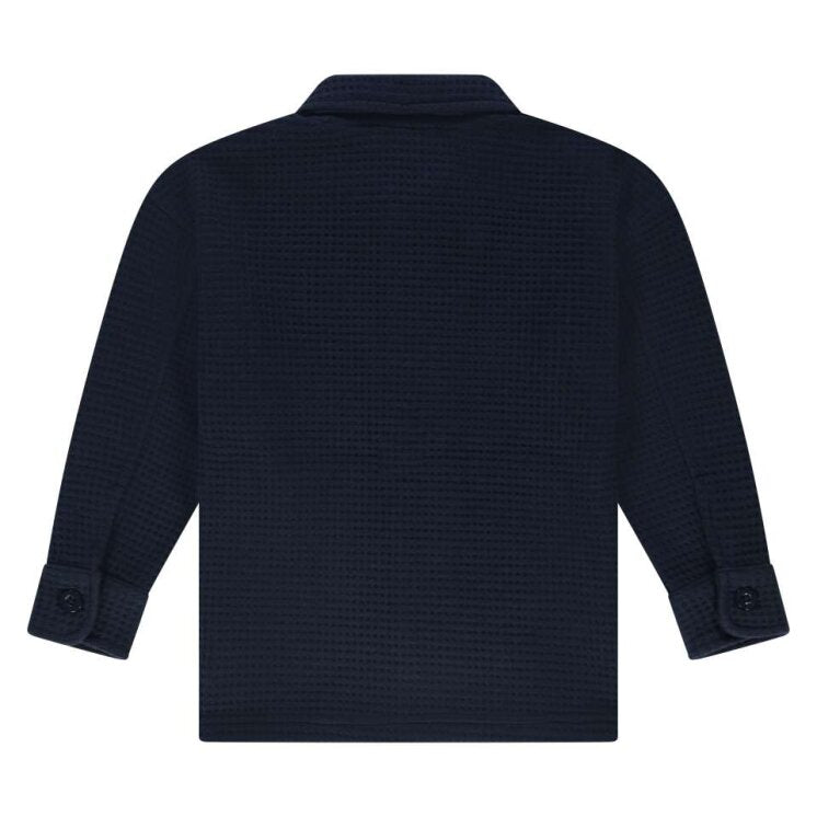 back of Navy blue textured shirt on a white background