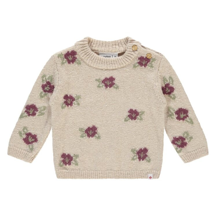 Beige sweater with floral patterns on a white background