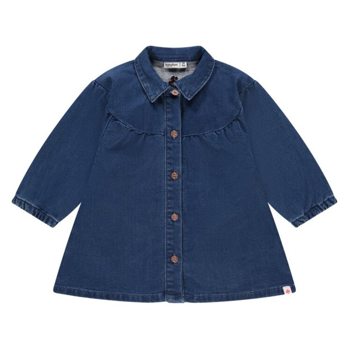 Blue denim shirt dress with buttons on a white background