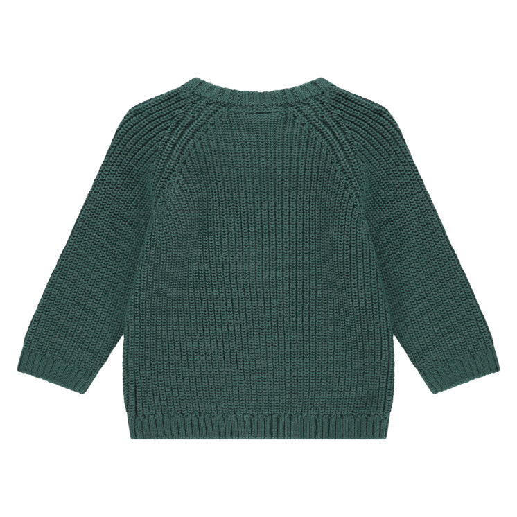 Green knitted sweater on a white background