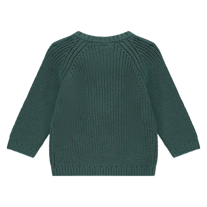Green knitted sweater on a white background