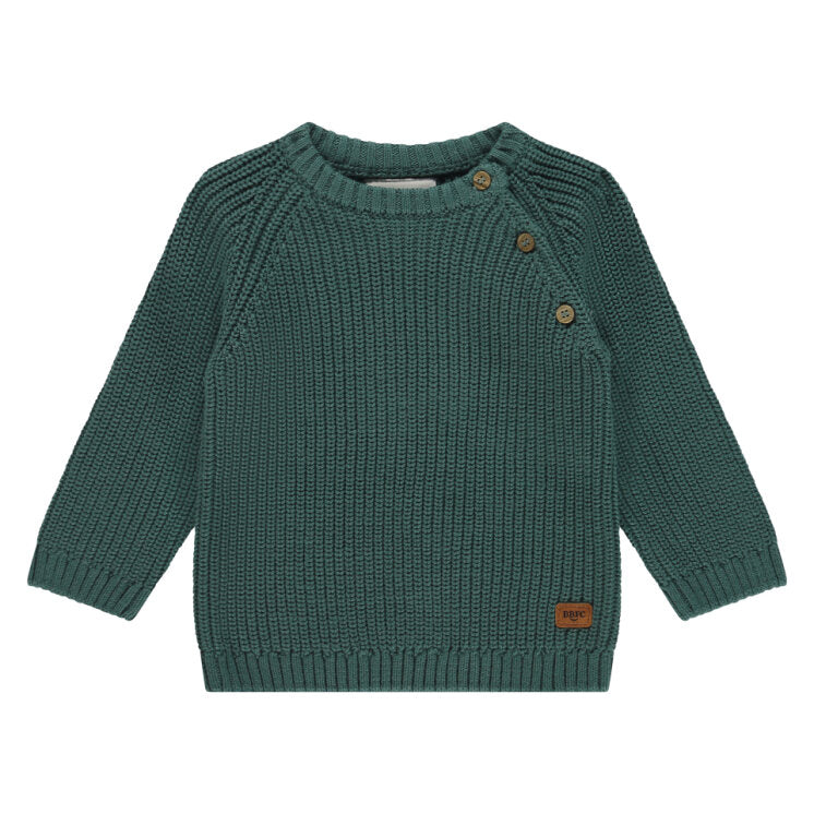 Green knitted sweater with brown buttons on a white background