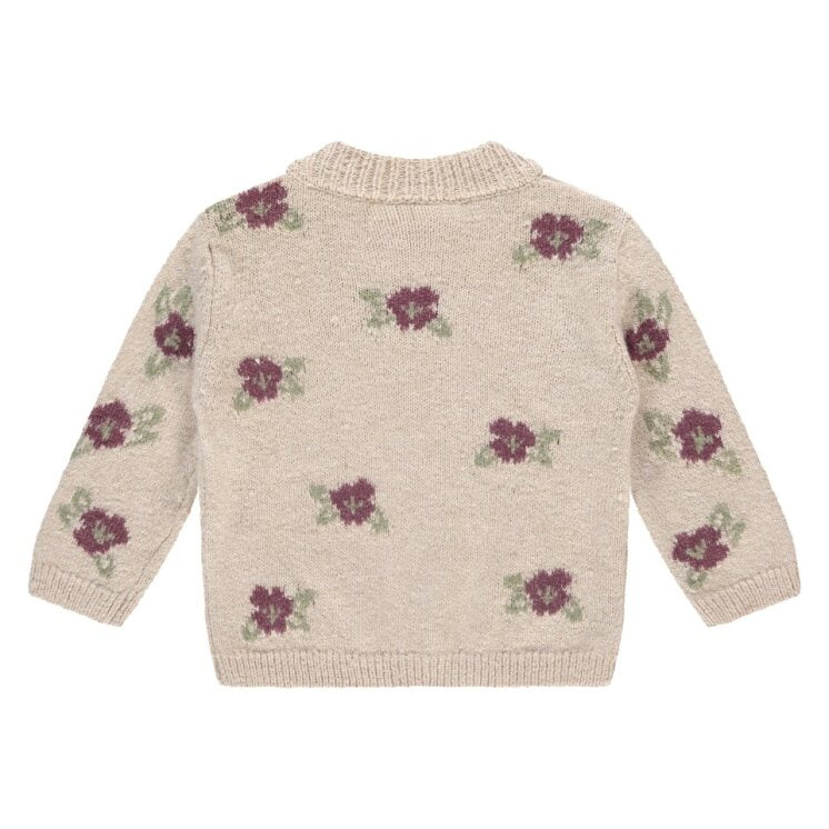 Knitted sweater with floral patterns on a white background