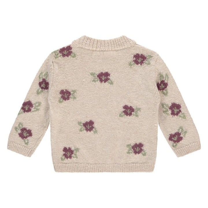 Knitted sweater with floral patterns on a white background