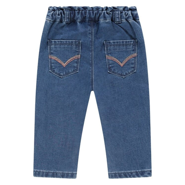 back of baby girl Blue denim pants with a white background