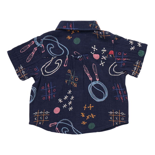 back of Navy blue shirt with colorful abstract patterns, jump ropes, chalk design of tic tac toe. 