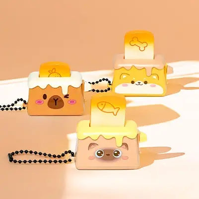 3 different kind of toasters, each with an animal face and a bread popping out to click down. 