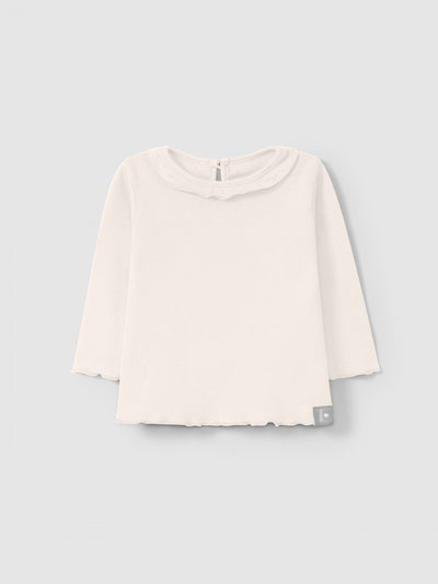 long sleeve light pink t-shirt with slight ruffle around the collar