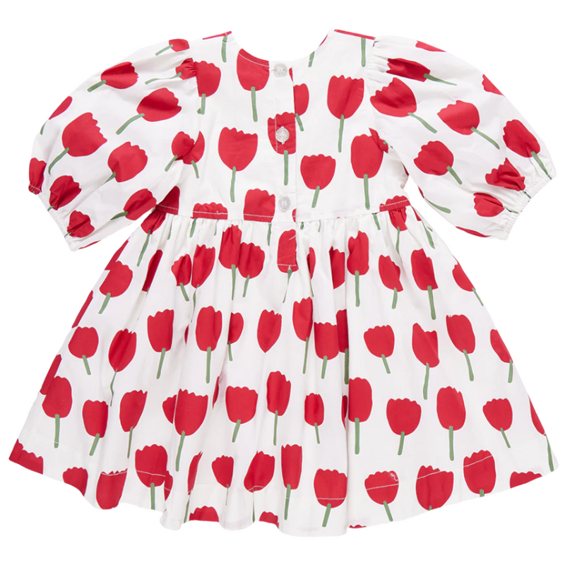 3/4 sleeve dress with white background and big red tulips all over the dress. buttons on the back. 