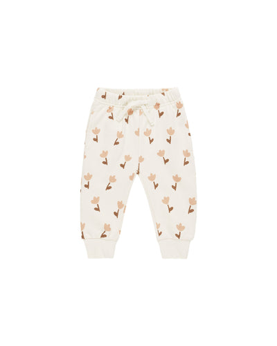 relaxed joggers, beige base color with dusty rose tulips and taupe stems and leaves print all over. 