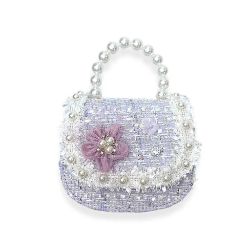 Decorative tweed pastel handbag with pearls and a pink flower on a white background