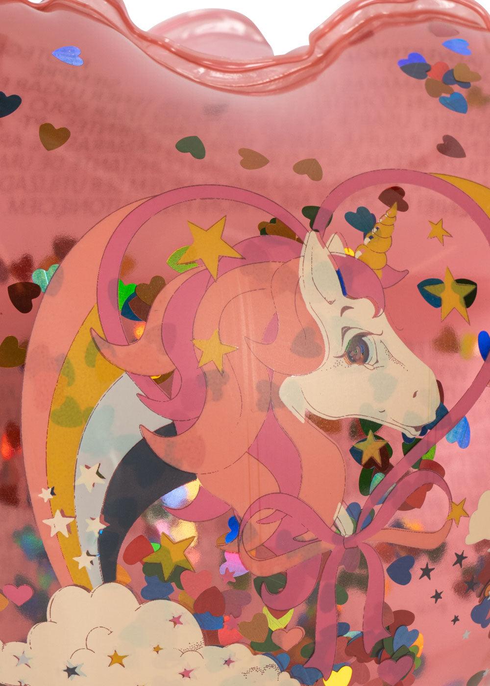 close up of the water wings with a unicorn on the outside and confetti on the inside. 