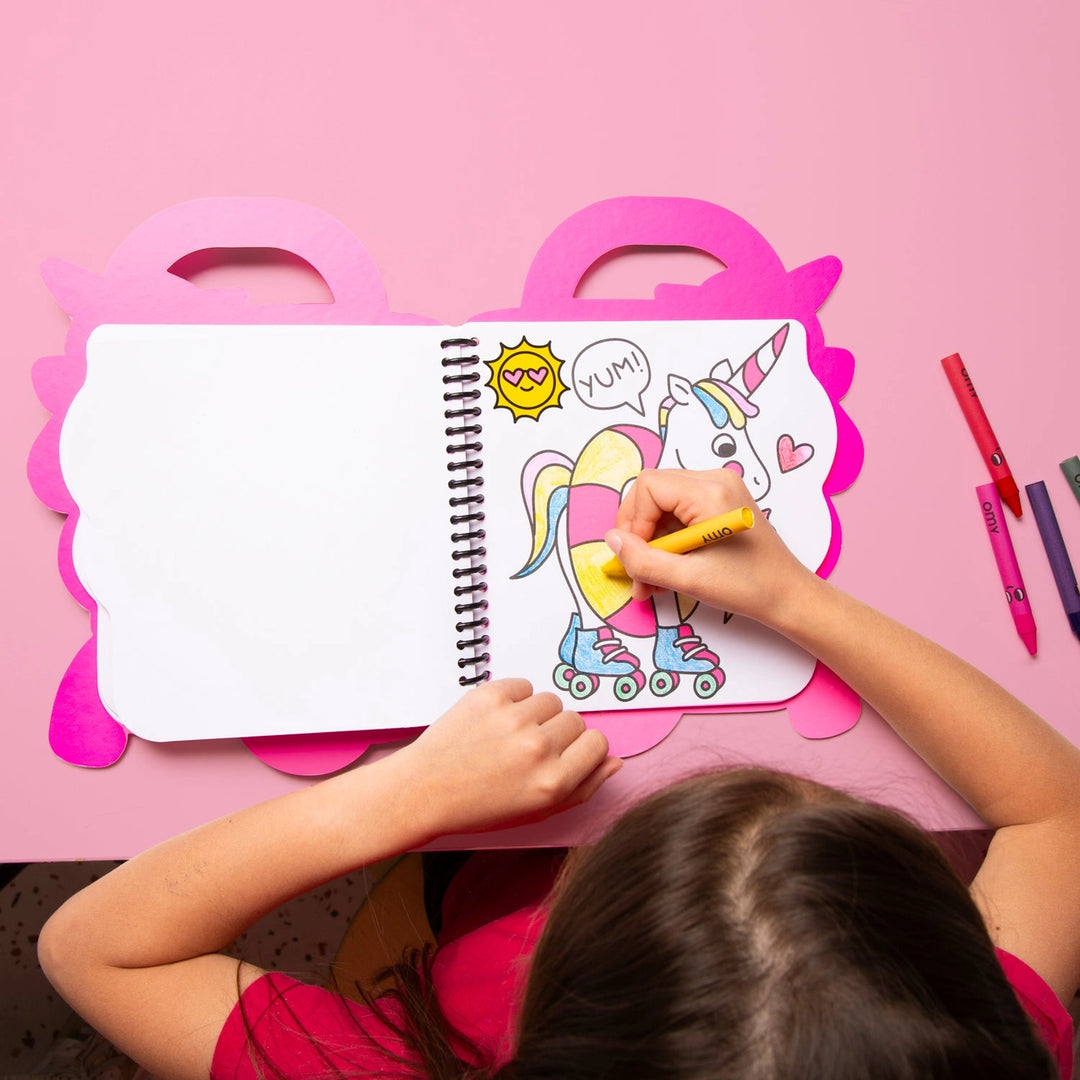 child coloring in a page with a unicorn in rollerskates