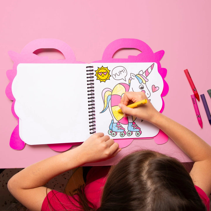 child coloring in a page with a unicorn in rollerskates