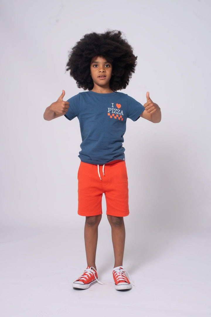 Boy wearing the Preston Short from Appaman paired back to I love pizza graphic tee from Appaman.