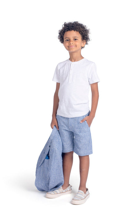 boy wearing blue shorts and white henley top