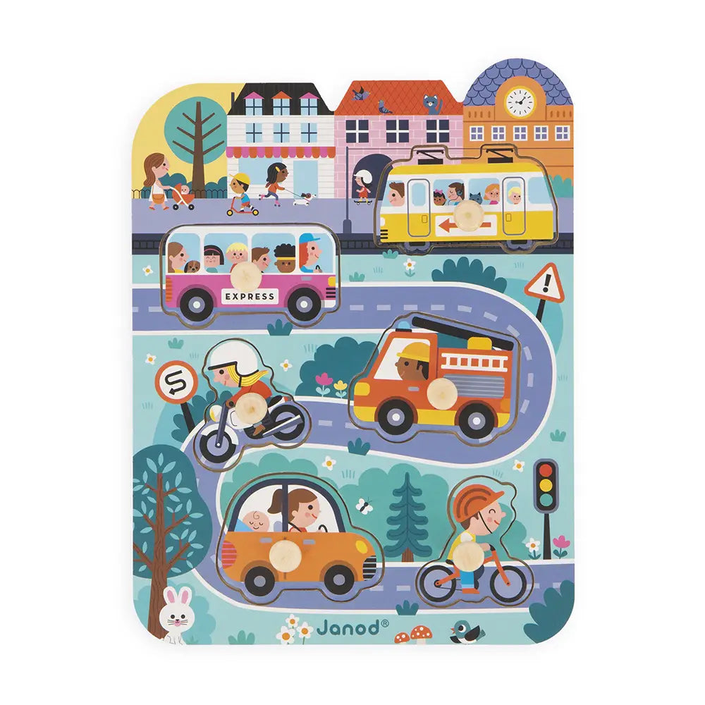 Children's puzzle with illustrated vehicles and people on a road, featuring the brand 'Janod'.