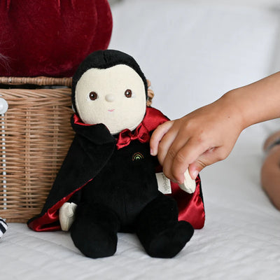 vincent vampire doll with black cloak and red lining on the inside. red bowtie. 