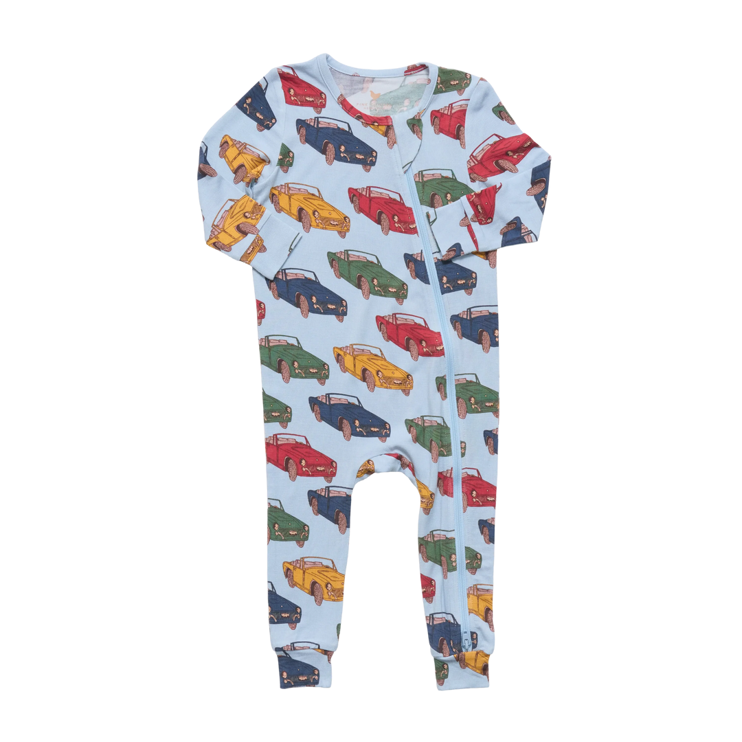 A baby long-sleeve footless romper in light blue, covered in a colorful pattern of vintage cars in red, yellow, green, and blue, shown against a plain white background.