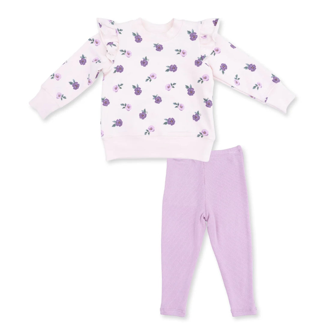 Children's  set with floral top and solid pants on a white background