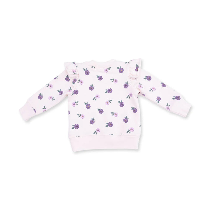 A light pink long-sleeve sweatshirt for toddlers, featuring an all-over print of small purple flowers with green leaves and ruffled details on the shoulders, shown against a plain white background.