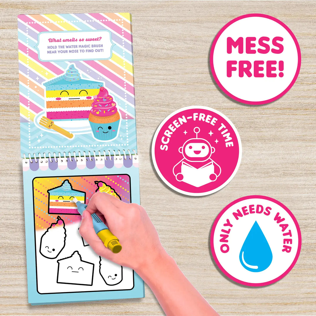 Coloring book with water-based markers, hand holding a marker, and 'mess free' and 'screen-free time' stickers on a wooden surface.