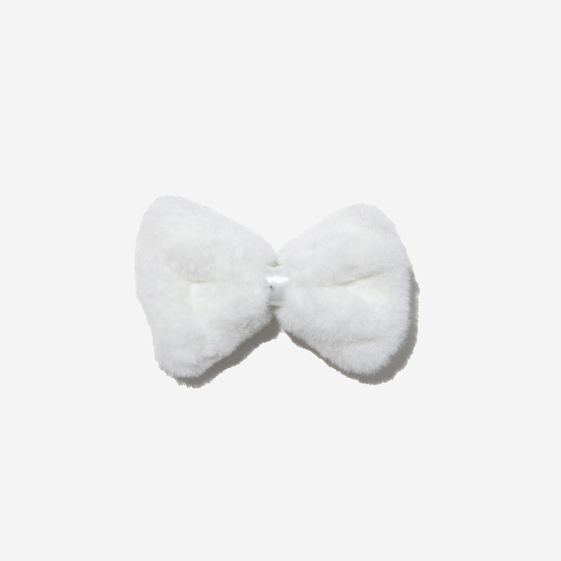 furry white bow attached to alligator clip. 