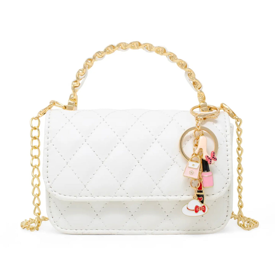 A small white quilted faux leather handbag with gold-tone chain handles and a decorative charm keychain featuring pink and red details, shown on a plain white background.