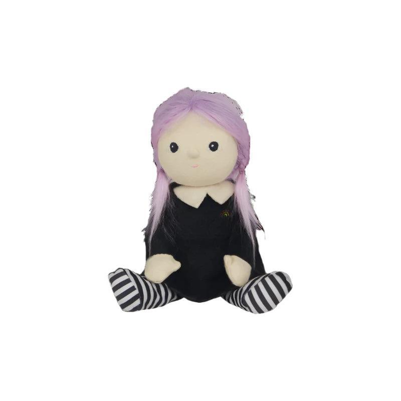witch doll sitting on its own with lavender hair and no hat at the moment. 