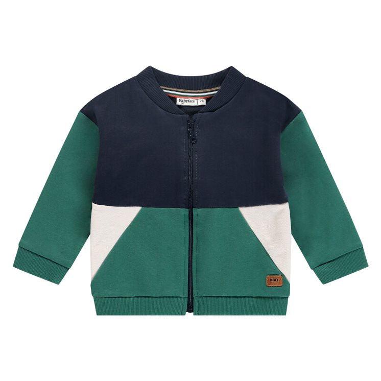 tricolor zip sweatshirt with navy at the top, green sleeves and green bottoms with beige inserts. 