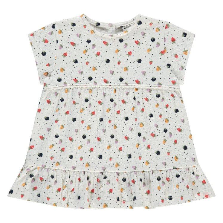 ivory baby girl dress with ruffle at the hem and tiny strawberries all over. strawberries were all different colors: pink, yellow, navy, lavender, and magenta. short sleeve. 