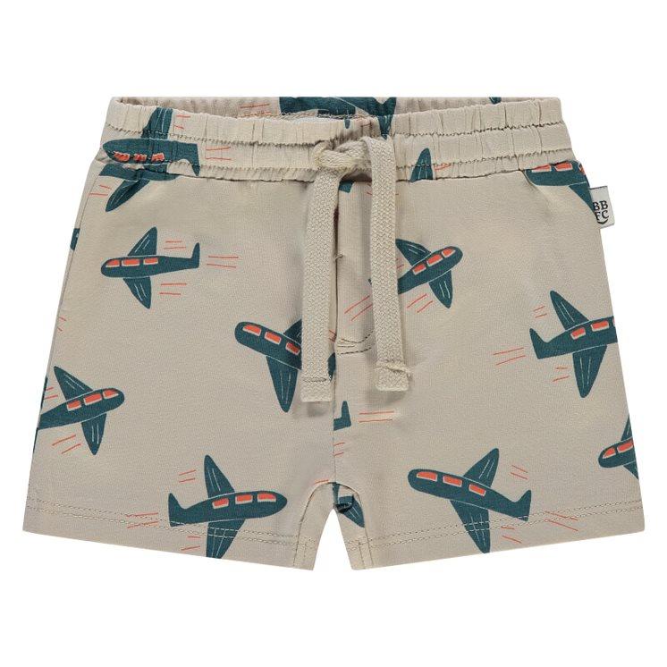 tan shorts with drawstring and green airplanes and orange windows. 