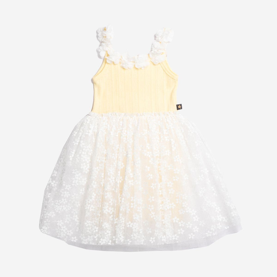Yellow dress with a white tulle skirt on a white background
