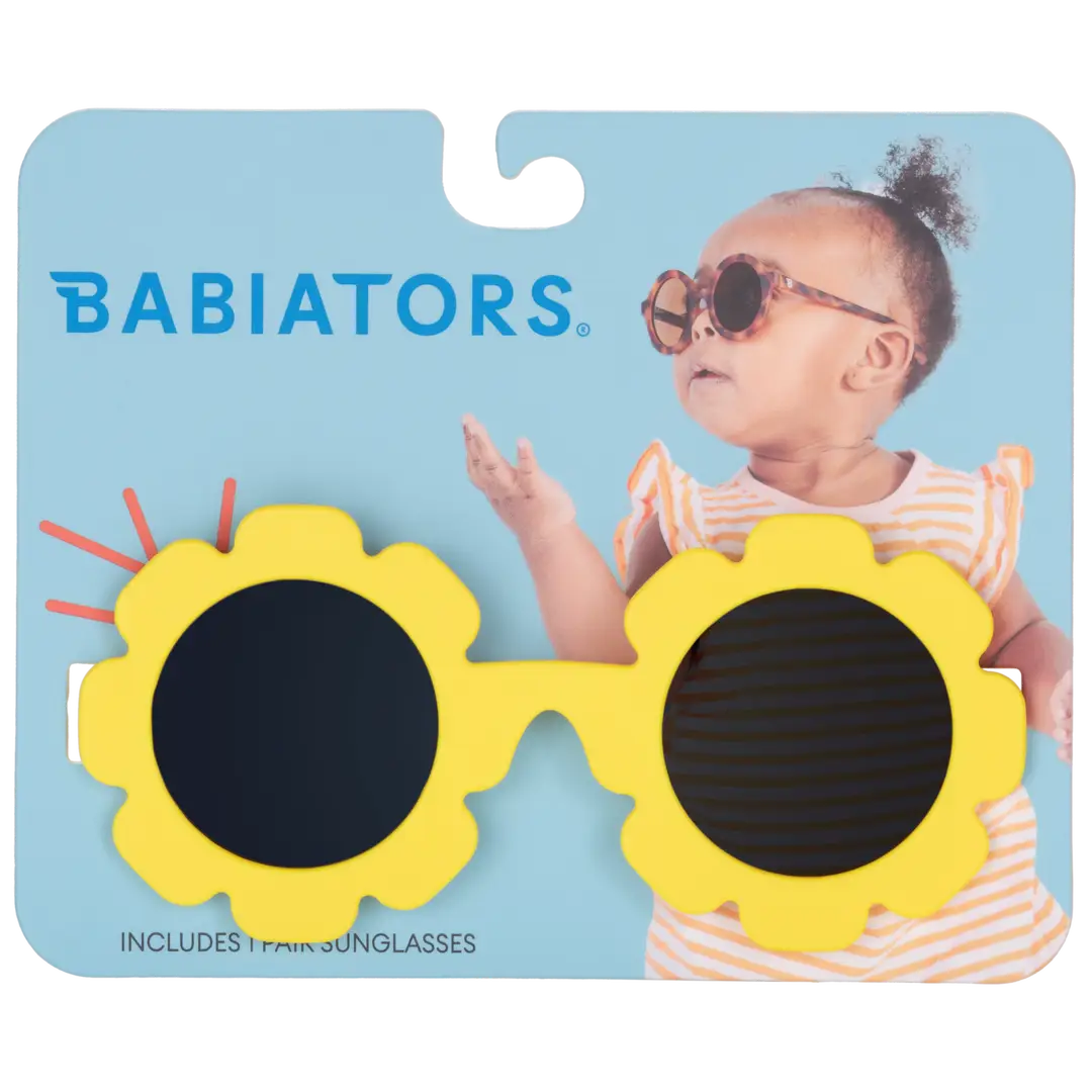 Babiators sunglasses with sunflower design on a blue card featuring a child model.