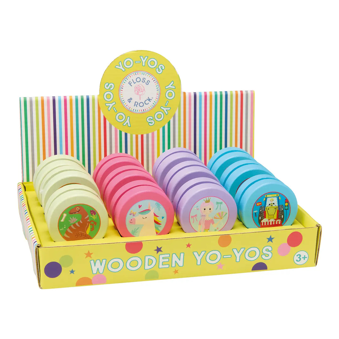 Colorful wooden yo-yos in a box with a striped background