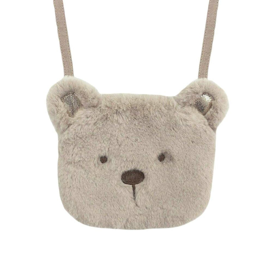 crossbody bag in the shape of a teddy bear head. teddy is fluffy attached to a tan strap